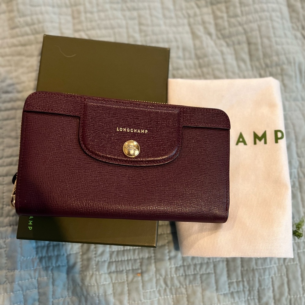 Beautiful burgundy, wallet by Longchamp. Excellent used condition.